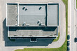 flat shingle roof of industrial building with ventilation systems. aerial top view