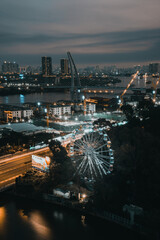 Aerial view of Bitexco Tower, buildings, roads, Thu Thiem 2 bridge and Saigon river in Ho Chi Minh city - Far away is Landmark 81 skyscraper. Travel concept.