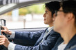© Peak River - 運転する男性と助手席で寝ている男性