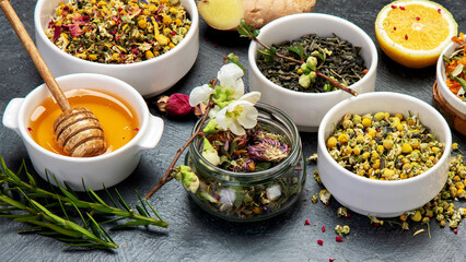 Canvas Print - Herbal tea assortment on dark background.