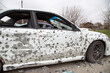 War in Ukraine. А car riddled with fragments of a mine.