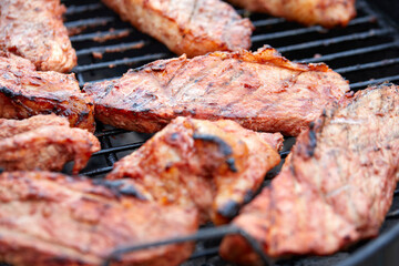 Canvas Print - Pork neck getting grilled outdoors