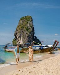 Wall Mural - Couple of men and women on vacation in Southern Thailand. happy couple travel trough Thailand