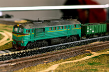 Close-up About Model Train On The Rail Tracks
