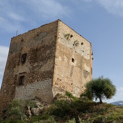 View of the Ulloa tower in the Granada town of Vélez de Benaudalla (Spain) on a sunny spring morning