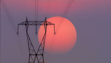 High Voltage Electricity Tower Silhouette At Sunset With Copy Space