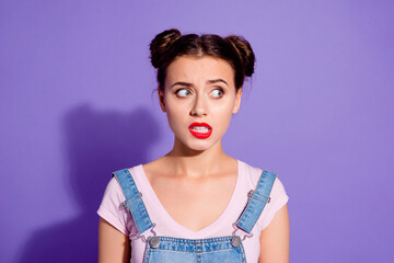 Wall Mural - Portrait of minded doubtful person grin teeth look interested empty space isolated on purple color background