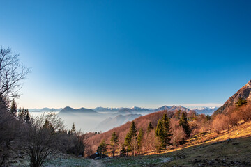 Wall Mural - Winter sunset from an alpine peak of Friuli-Venezia Giulia