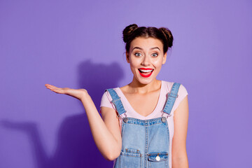 Wall Mural - photo of cheerful funky person arm palm hold demonstrate empty space proposition isolated on violet 