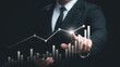 © Thapana_Studio - Businessman touching virtual screen and data statistical index graph, stock market data and stock exchange concept, stock market financial analysis graph.