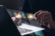© Thapana_Studio - Businessman touching virtual screen Graph analysis of business growth and investment, strategic planning to increase sales profits, long-term business plan.