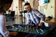 © JustLife - Colleagues having fun at work. Businessman and businesswoman playing table soccer..