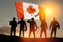 Canada Army Soldiers With Canada Flag On A Background Of Sunset Or Sunrise. Greeting Card For Poppy Day, Remembrance Day. Canada Celebration. Concept - Patriotism, Honor.