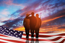 USA Army Soldiers Saluting With Nation Flag On A Background Of Sunset Or Sunrise. Greeting Card For Veterans Day, Memorial Day, Independence Day. America Celebration. 3D-rendering.
