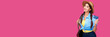 © khmelev - Smiling caucasian woman holding credit card isolated on pink background. Online shopping, e-commerce, internet banking, spending money, enjoying life concepts