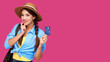 © khmelev - Smiling caucasian woman holding credit card isolated on pink background. Online shopping, e-commerce, internet banking, spending money, enjoying life concepts