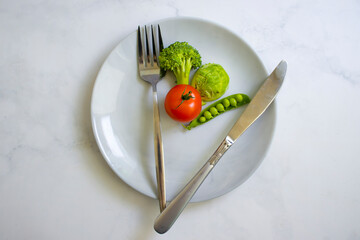 Wall Mural - Vegetables on a plate, broccoli, cabbage, tomato