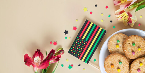 creative banner for Juneteenth day with Black Liberation African American flags, tea cakes cookie and bright flowers