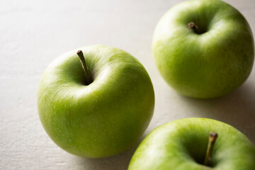 Wall Mural - Green apples on the table, close up