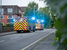 Two UK British Fire Engines At Incident On Blue Lights