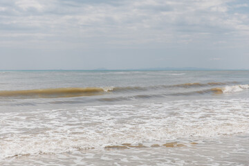 Poster - Seascape. Foam waves at sandy beach. Waterscape for background. Nature concept. Soft focus. Motion waves. Copy space.