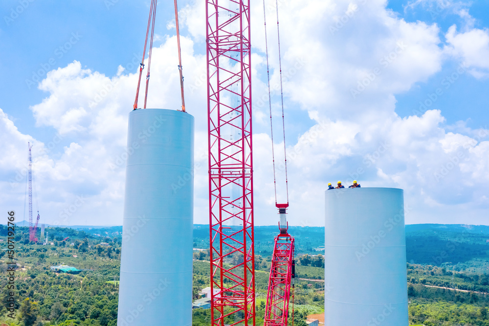 Installing of wind turbine tower with construction crane, Power plant ...