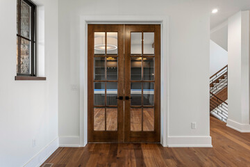 Closed wooden french doors to office