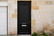 Wooden Door dark modern on french home street facade