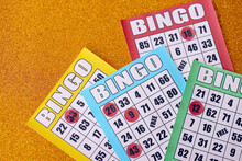 Many Colorful Bingo Boards Or Playing Cards For Winning Chips. Classic US Or Canadian Five To Five Bingo Cards On Bright Background