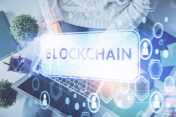 Aufkleber - Double exposure of woman hands working on computer and blockchain theme hologram drawing. Top View. bitcoin cryptocurrency concept.