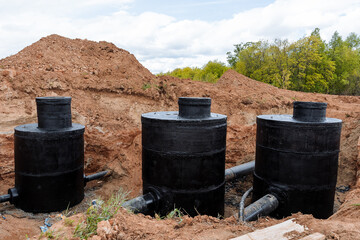 Canvas Print - Waterproofing of water wells, hydraulic unit, concrete rings, sewerage bitumen protection, well connection pipeline, clay pit moat, repair work