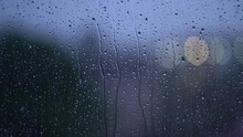 Moody Rain On Window During Storm With Bokeh Traffic Lights