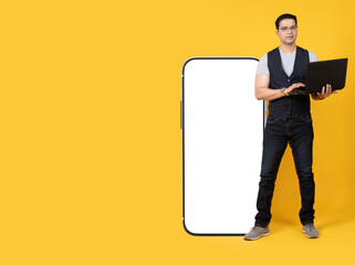 Poster - A man with a big phone. Place for the inscription on the smartphone monitor. A phone with an empty white screen. The man leans on a large smartphone. A person shows the screen. 