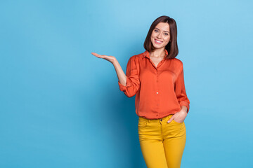 Wall Mural - photo of young pretty lady promoter present product offer select advert discount isolated over blue 