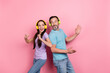 © deagreez - Photo of two excited crazy people enjoy listen favorite song dancing isolated on pink color background