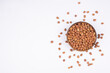 chickpeas (Bengal Gram) in rock bowl on white background. Close up of Organic chana or chickpea (Cicer arietinum). for design and banner. top view chickpeas.