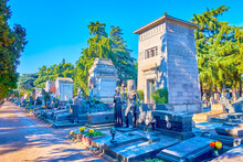 The Funeral Tombs And Graves Of Memorial Cemetery Are Decorated With Outstanding Sculptures And Other Art Decorations, Milan, Italy