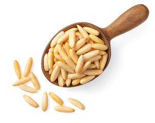 Wall Mural - Roasted pine nuts in the wooden spoon, isolated on white background, top view.
