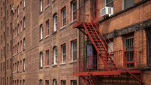 New York City Brick Building With Red Fire Escape