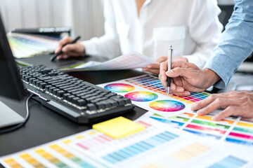 Aufkleber - Team of creative graphic designer working on color swatch samples chart for selection coloring in inspiration to create new collection at workplace
