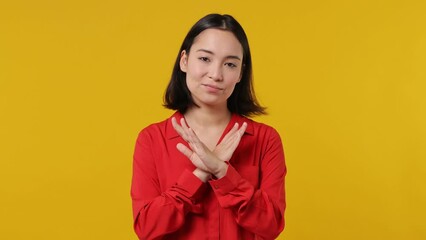 Wall Mural - Confident bright sad young woman of Asian ethnicity 20s wears red shirt look camera point fingers herself ask say who me no thanks i do not need it isolated on plain yellow background studio portrait