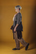 © qunica.com - Portrait of a smart young man standing against yellow backgroun