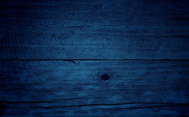 Wall Mural - old blue wood texture background. close up blue wooden table showing rough wood grain and wood pith. old plank lumber wood. colorful wooden background grunge.