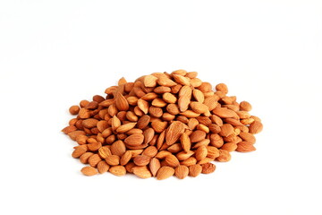 Wall Mural - heap of brown dry fruit apricot seeds isolated in white background