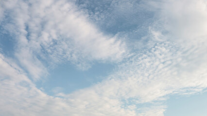 Wall Mural - deep blue skies with white clouds background with space for text, blue cloudy skies texture