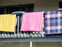Drying Colorful Laundry On Balcony Rail
