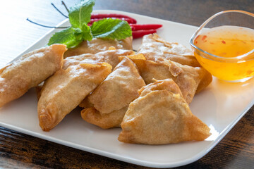 Wall Mural - samosa on a plate with sweet and sour sauce