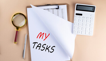 Poster - Clipboard with chart and text MY TASKS with magnifier ,calculator on beige background
