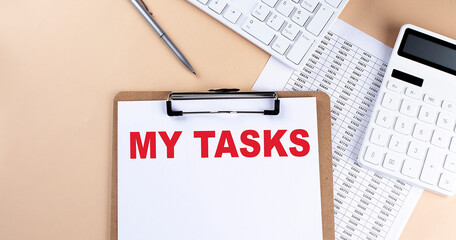 Poster - clipboard with white blank paper text MY TASKS , keyboard calculator and chart, top view. business concept.