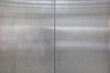 stainless steel door background and texture. elevator metal door.
